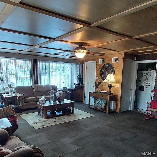 2106 Lackland Rd, Saint Louis, MO 63114 - living area with wooden walls, plenty of natural light, carpet flooring, ceiling fan, and beamed ceiling