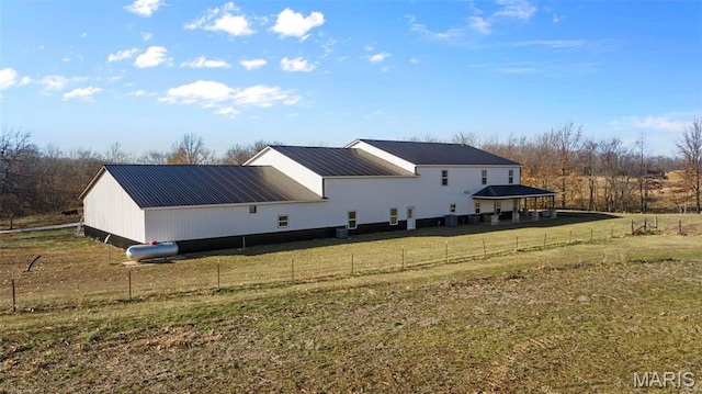 284 Ridge Rd, Oak Ridge, MO 63769 - rear view of property with metal roof