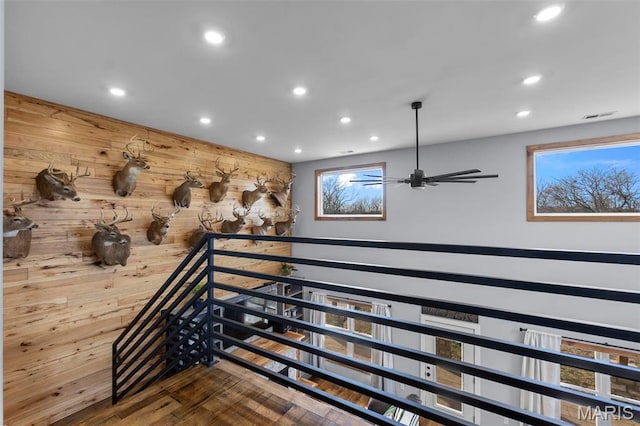 284 Ridge Rd, Oak Ridge, MO 63769 - staircase with recessed lighting, wooden walls, ceiling fan, and wood finished floors