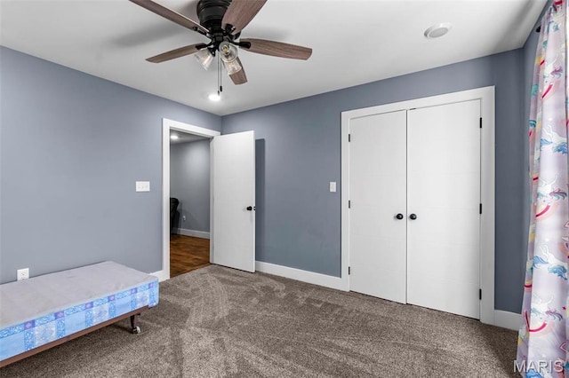 284 Ridge Rd, Oak Ridge, MO 63769 - unfurnished bedroom featuring carpet floors, a closet, baseboards, and ceiling fan