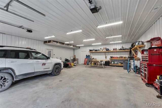 284 Ridge Rd, Oak Ridge, MO 63769 - garage featuring a workshop area and a garage door opener