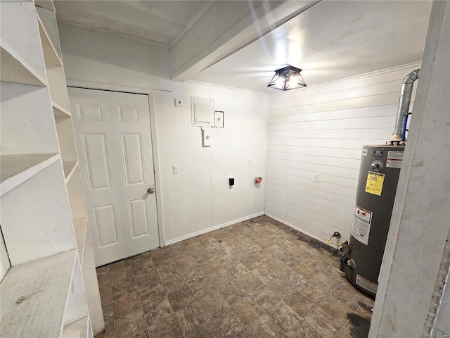 laundry room with water heater, stone finish floors, wood walls, and ornamental molding