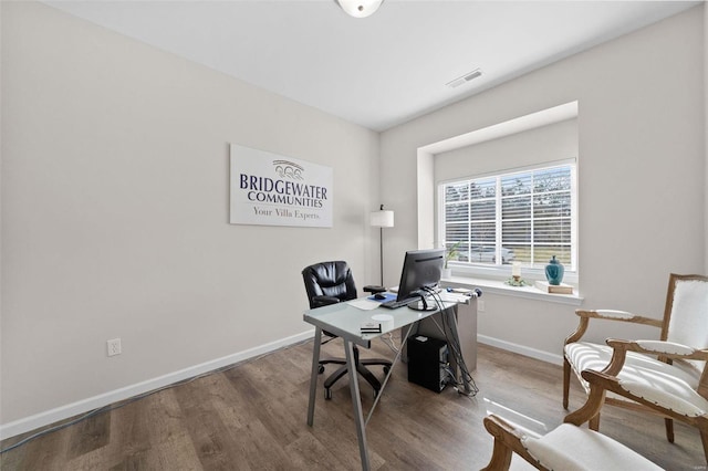 home office with wood finished floors and baseboards