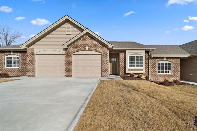 ranch-style house featuring brick siding, an attached garage, driveway, a shingled roof, and a front lawn