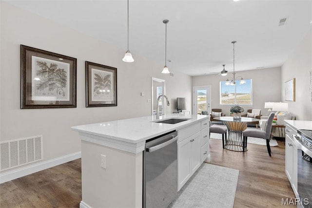 889 Walter Way, Washington, MO 63090 - kitchen with appliances with stainless steel finishes, a sink, open floor plan, light wood-style floors, and white cabinetry