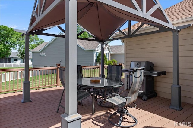 wooden deck with outdoor dining space