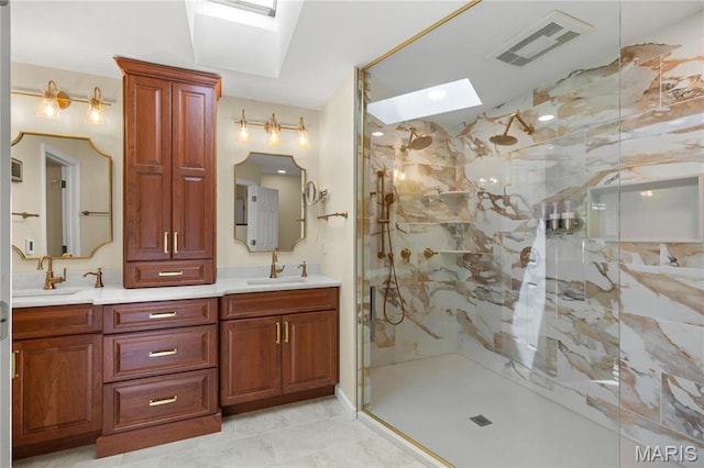 full bath featuring a skylight, a marble finish shower, and double vanity