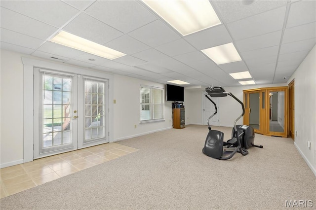 workout area featuring carpet floors, french doors, baseboards, and a drop ceiling