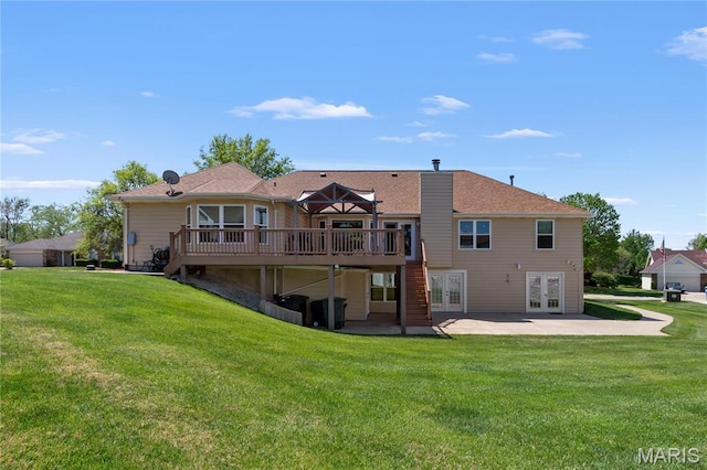 back of house featuring french doors, a wooden deck, a yard, and a patio