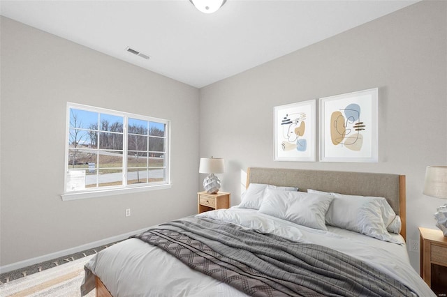 bedroom featuring baseboards and carpet flooring