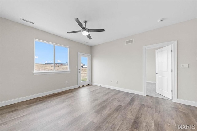 887 Walter Way, Washington, MO 63090 - unfurnished room with wood finished floors, ceiling fan, and baseboards