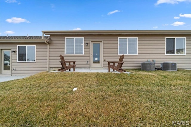 885 Walter Way, Washington, MO 63090 - rear view of house featuring cooling unit, a patio area, and a lawn