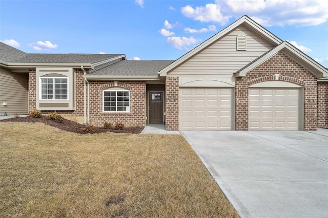 ranch-style home featuring an attached garage, brick siding, concrete driveway, a front yard, and roof with shingles