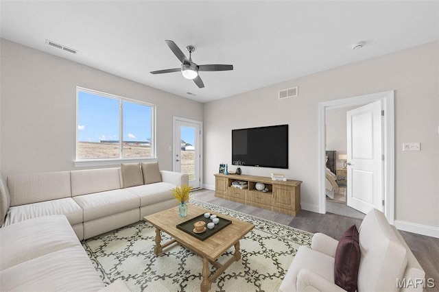 883 Walter Way, Washington, MO 63090 - living area featuring ceiling fan, baseboards, and wood finished floors
