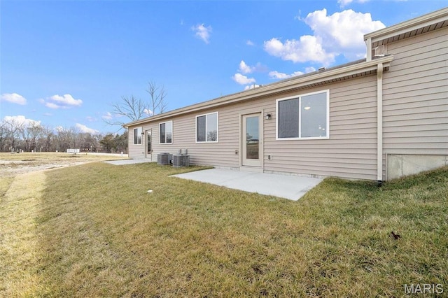 883 Walter Way, Washington, MO 63090 - rear view of house with a patio, central AC unit, and a lawn