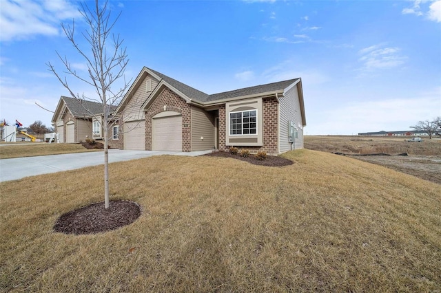 ranch-style home with brick siding, an attached garage, driveway, a front yard, and roof with shingles