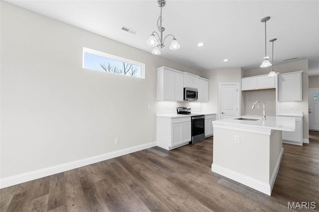 881 Walter Way, Washington, MO 63090 - kitchen featuring appliances with stainless steel finishes, a sink, dark wood-type flooring, baseboards, and recessed lighting