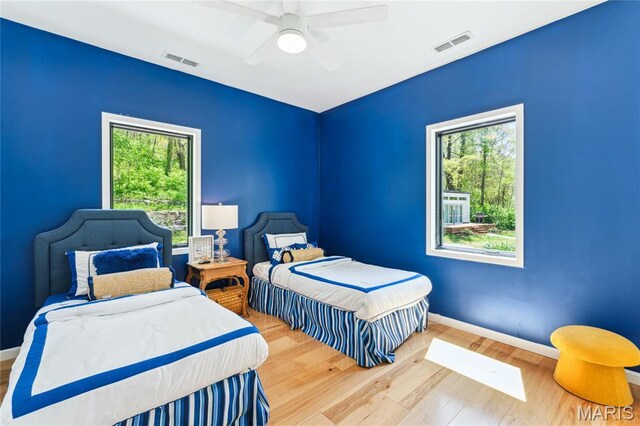 2510 N 89th St, Caseyville, IL 62232 - bedroom featuring wood finished floors, multiple windows, and baseboards