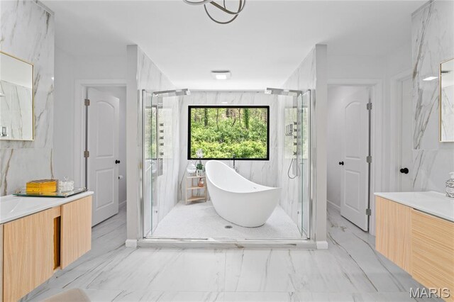 2510 N 89th St, Caseyville, IL 62232 - full bathroom with vanity, a soaking tub, a marble finish shower, and marble look tile flooring
