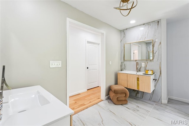 2510 N 89th St, Caseyville, IL 62232 - full bath with vanity, marble look tiles, and baseboards