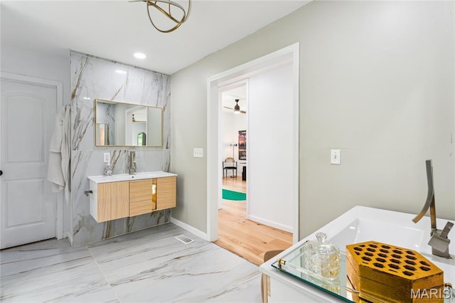 2510 N 89th St, Caseyville, IL 62232 - bathroom with vanity, marble finish floors, and baseboards