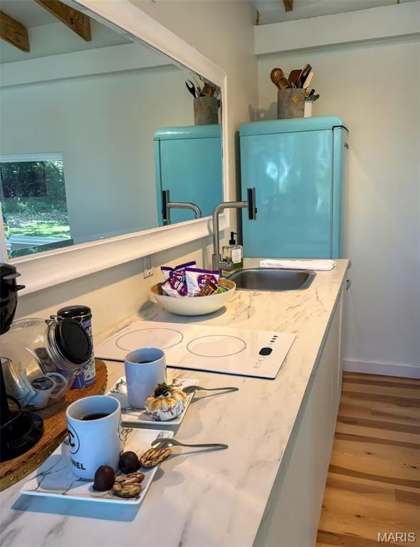 2510 N 89th St, Caseyville, IL 62232 - bathroom with a sink, wood finished floors, and beam ceiling