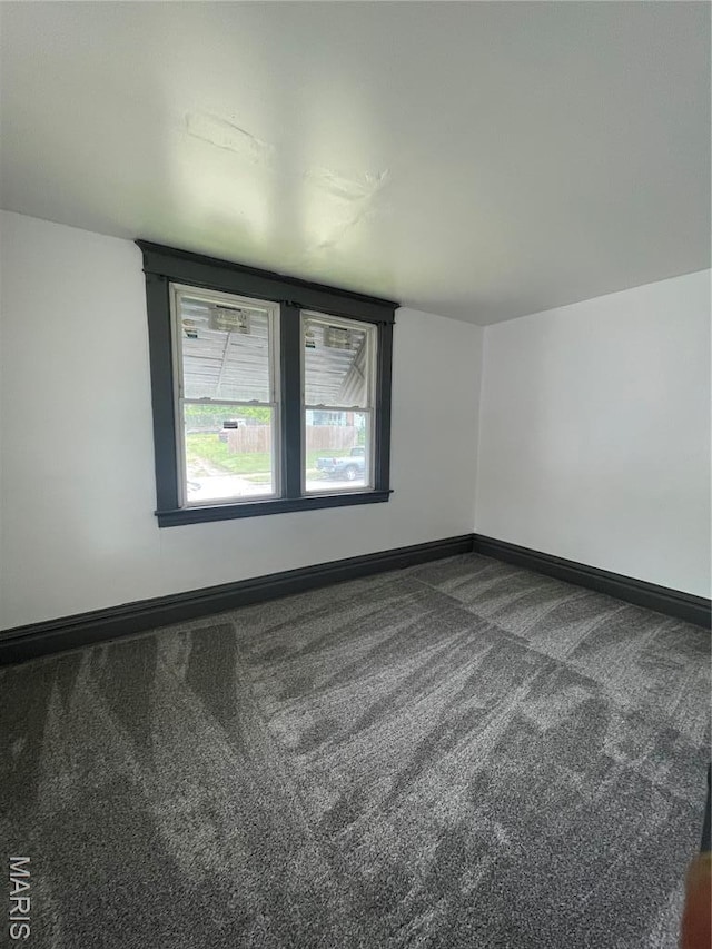 4947 Rosalie St, Saint Louis, MO 63115 - empty room featuring carpet flooring and baseboards