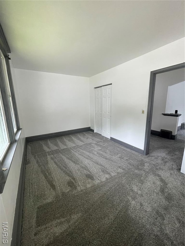 4947 Rosalie St, Saint Louis, MO 63115 - carpeted empty room featuring baseboards