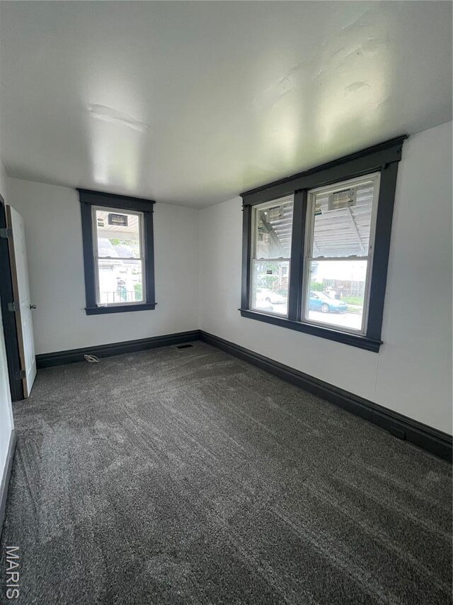 4947 Rosalie St, Saint Louis, MO 63115 - unfurnished room featuring carpet and baseboards
