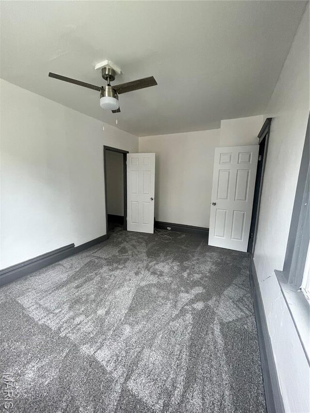 4947 Rosalie St, Saint Louis, MO 63115 - unfurnished bedroom with carpet floors, baseboards, and ceiling fan