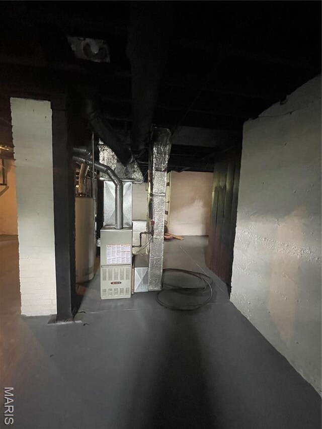 4947 Rosalie St, Saint Louis, MO 63115 - unfinished below grade area with heating unit and gas water heater