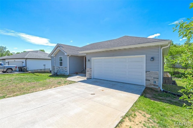 135 Mary Catherine, Waynesville, MO 65583 - single story home with concrete driveway, a garage, a front lawn, stone siding, and a shingled roof