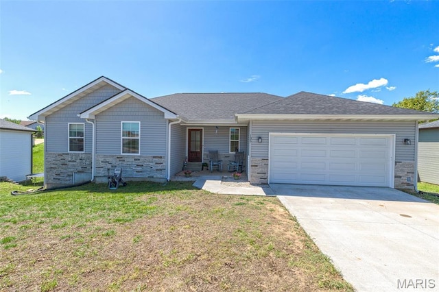 135 Mary Catherine, Waynesville, MO 65583 - view of front of home featuring stone siding, an attached garage, a front lawn, and driveway