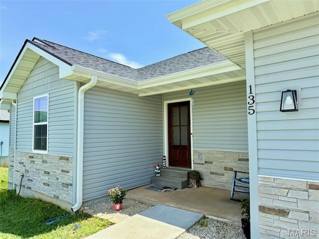135 Mary Catherine, Waynesville, MO 65583 - view of exterior entry featuring a shingled roof and stone siding