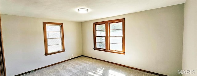 1606 New Madrid St, Cape Girardeau, MO 63701 - empty room featuring healthy amount of natural light, baseboards, and light colored carpet