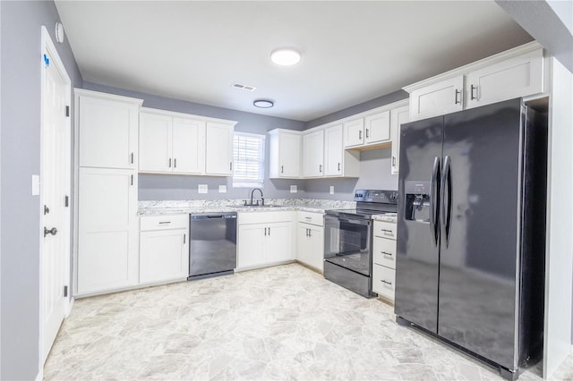 2347 Arkansas Ave, Poplar Bluff, MO 63901 - kitchen featuring black appliances, a sink, white cabinets, and light stone countertops