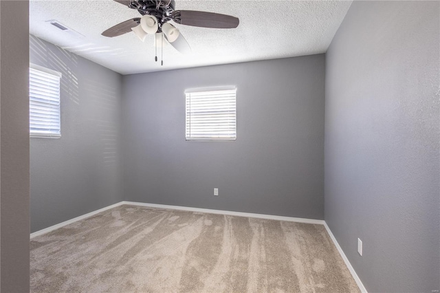 2347 Arkansas Ave, Poplar Bluff, MO 63901 - empty room featuring carpet, a ceiling fan, a textured ceiling, and baseboards