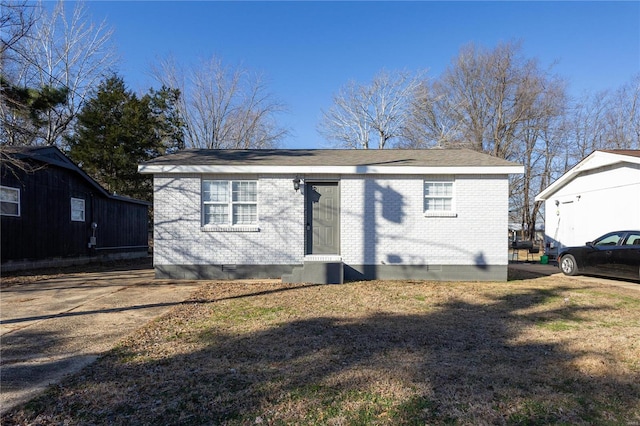 2347 Arkansas Ave, Poplar Bluff, MO 63901 - view of front of home featuring crawl space, brick siding, a front lawn, and entry steps