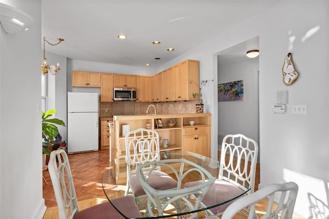 dining space with recessed lighting