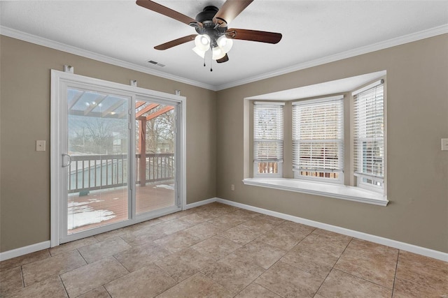 unfurnished room featuring plenty of natural light, ornamental molding, baseboards, and ceiling fan