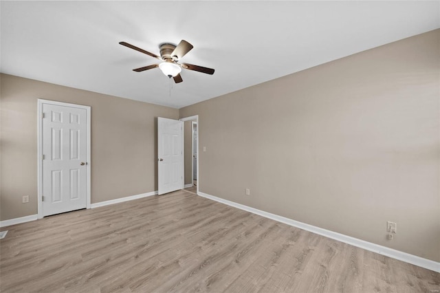 unfurnished bedroom with baseboards, light wood finished floors, and a ceiling fan