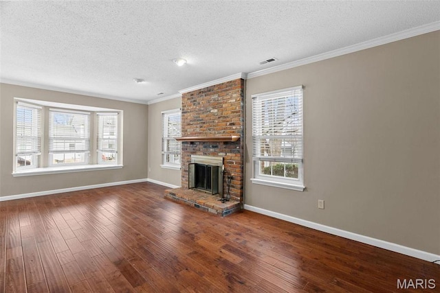 1619 Florine Boulevard E, Saint Charles, MO 63303 - unfurnished living room with hardwood / wood-style floors, a textured ceiling, healthy amount of natural light, crown molding, and a brick fireplace