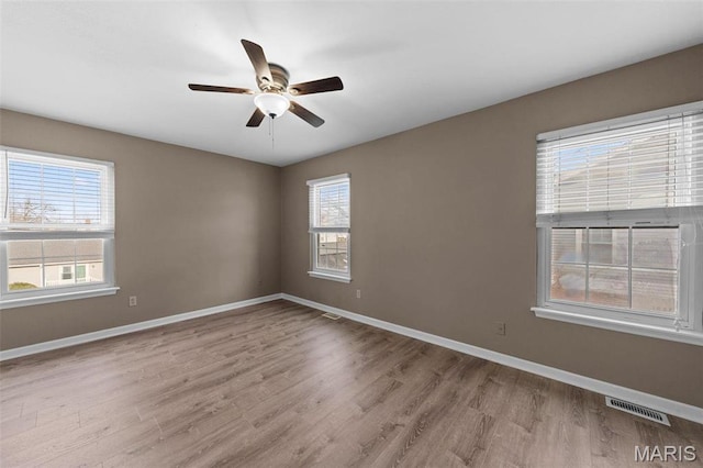 1619 Florine Boulevard E, Saint Charles, MO 63303 - spare room with wood finished floors and ceiling fan