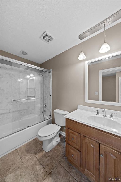 1619 Florine Boulevard E, Saint Charles, MO 63303 - full bathroom featuring vanity, enclosed tub / shower combo, and tile patterned floors