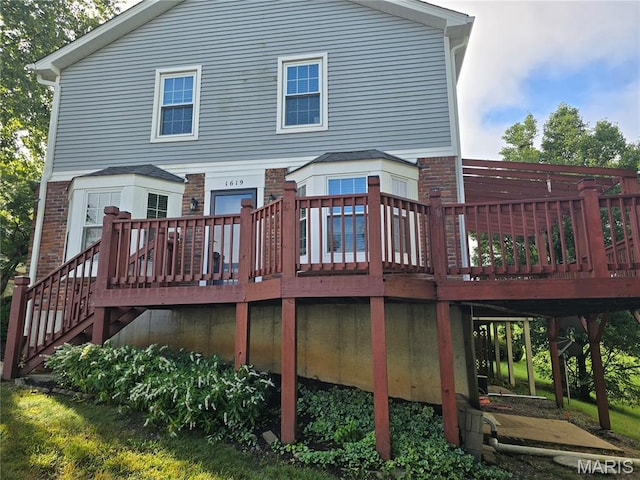 1619 Florine Boulevard E, Saint Charles, MO 63303 - back of property with a deck, stairway, and brick siding