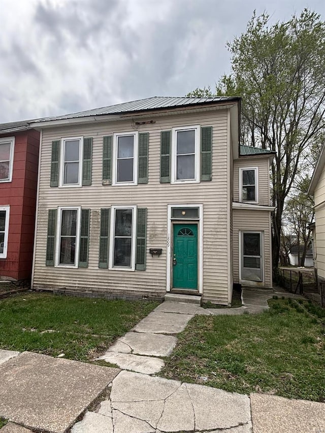 1809 Chestnut St, Hannibal, MO 63401 - view of front facade with metal roof and a front yard