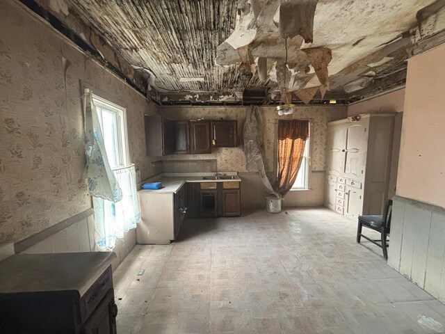 1809 Chestnut St, Hannibal, MO 63401 - unfurnished living room featuring wainscoting and a sink