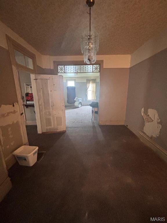1809 Chestnut St, Hannibal, MO 63401 - hallway with dark carpet and baseboards