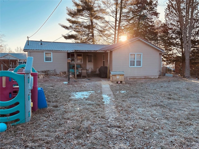 128 Pine St, Ironton, MO 63650 - back of property featuring metal roof and a playground