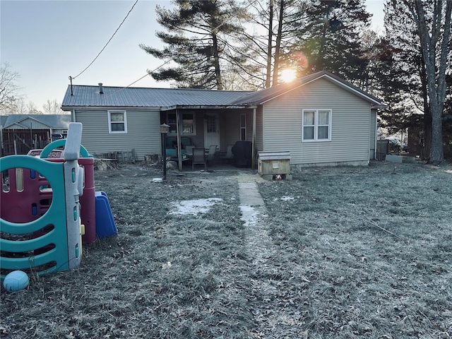 128 Pine St, Ironton, MO 63650 - back of house featuring a playground and metal roof